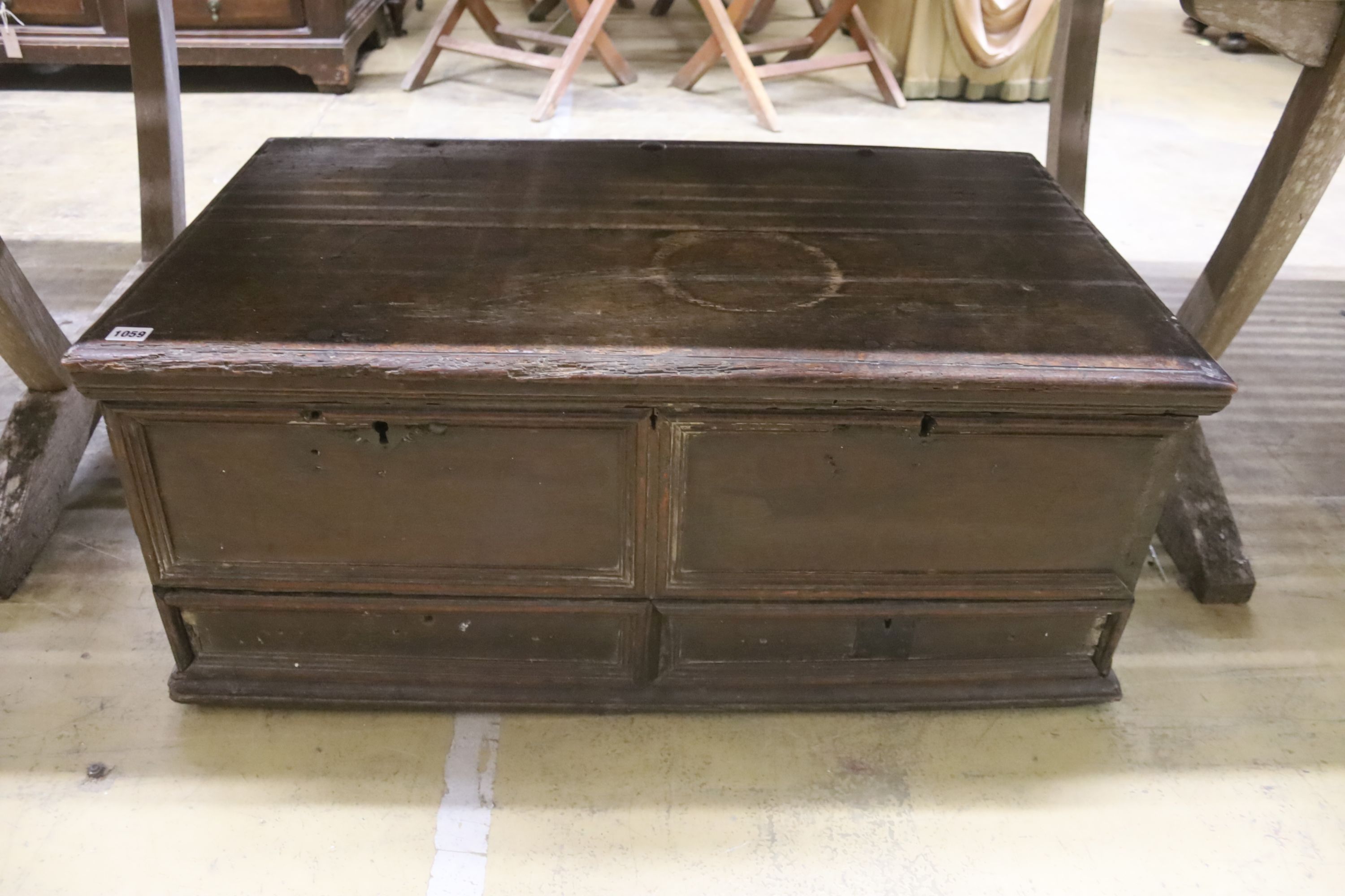 An 18th century oak trunk with dummy drawer front, width 92cm, depth 53cm, height 39cm